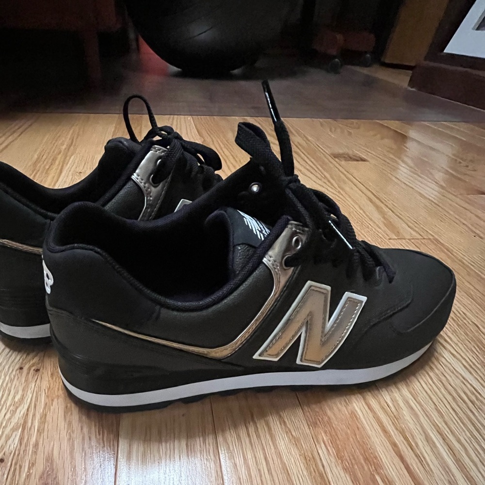 New Balance 574 Black and Gold Bronze Sneakers
